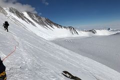 
Branscomb Peak And Pr�ncipe de Asturias Peak With Mount Vinson Low Camp Below On Branscomb Glacier From Rest Stop In The Rock Band On The Climb Up The Fixed Ropes To High Camp
